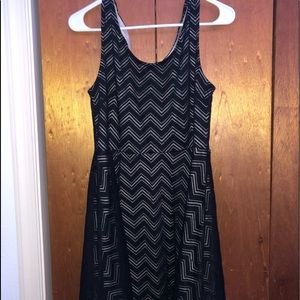 patterned short black dress.